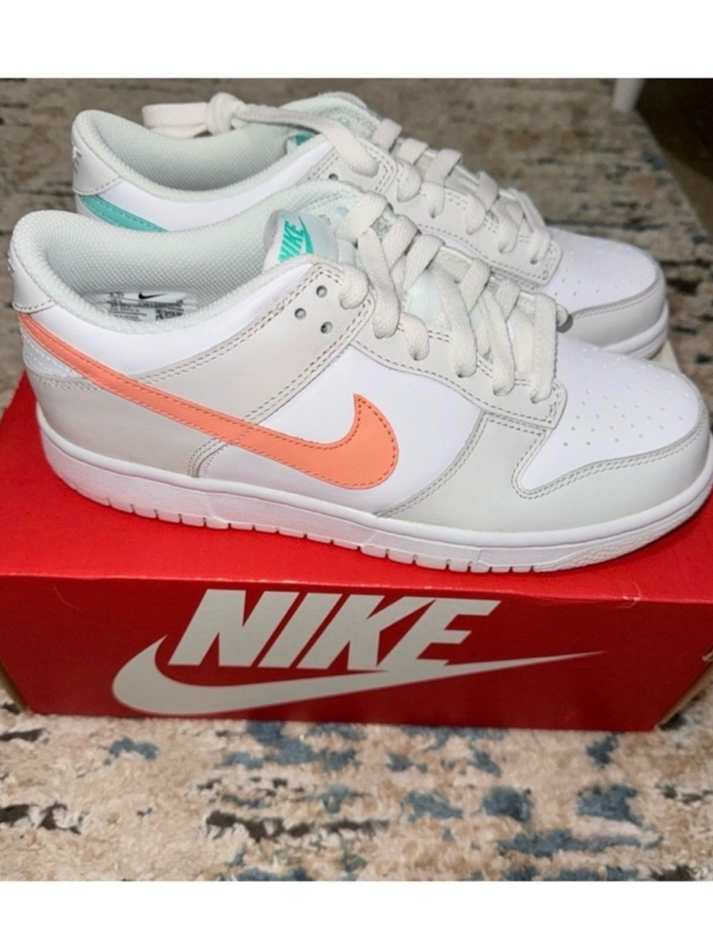 Nike White Low-Top Sneakers with Peach Swoosh